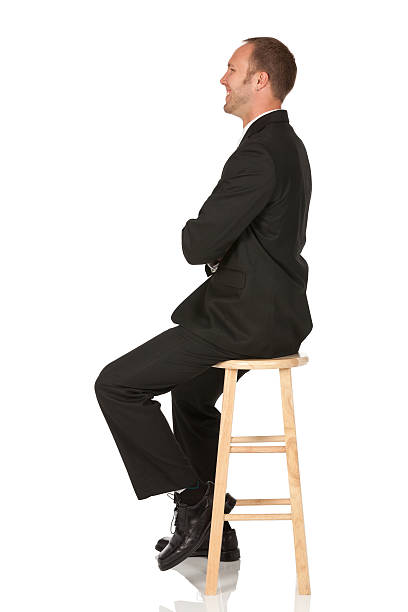 istock Businessman sitting on a stool with his arms crossed 175263371