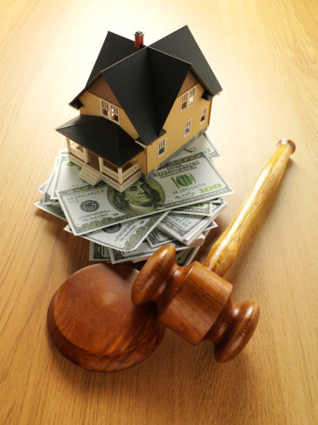 istock Model House on American Dollars with a Gavel and Mallet 175264057