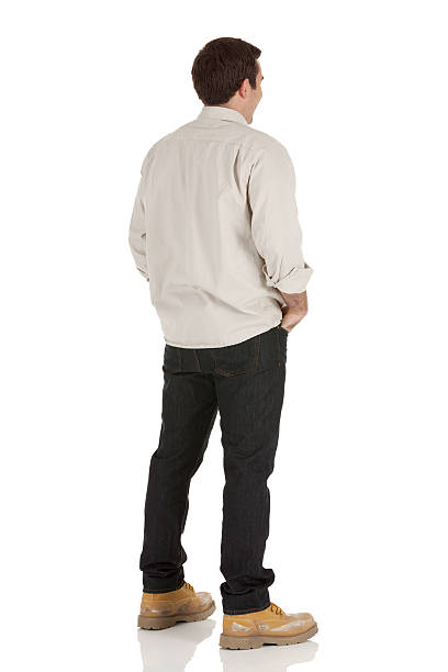 istock Rear view of a young man with hands in pockets 175264112