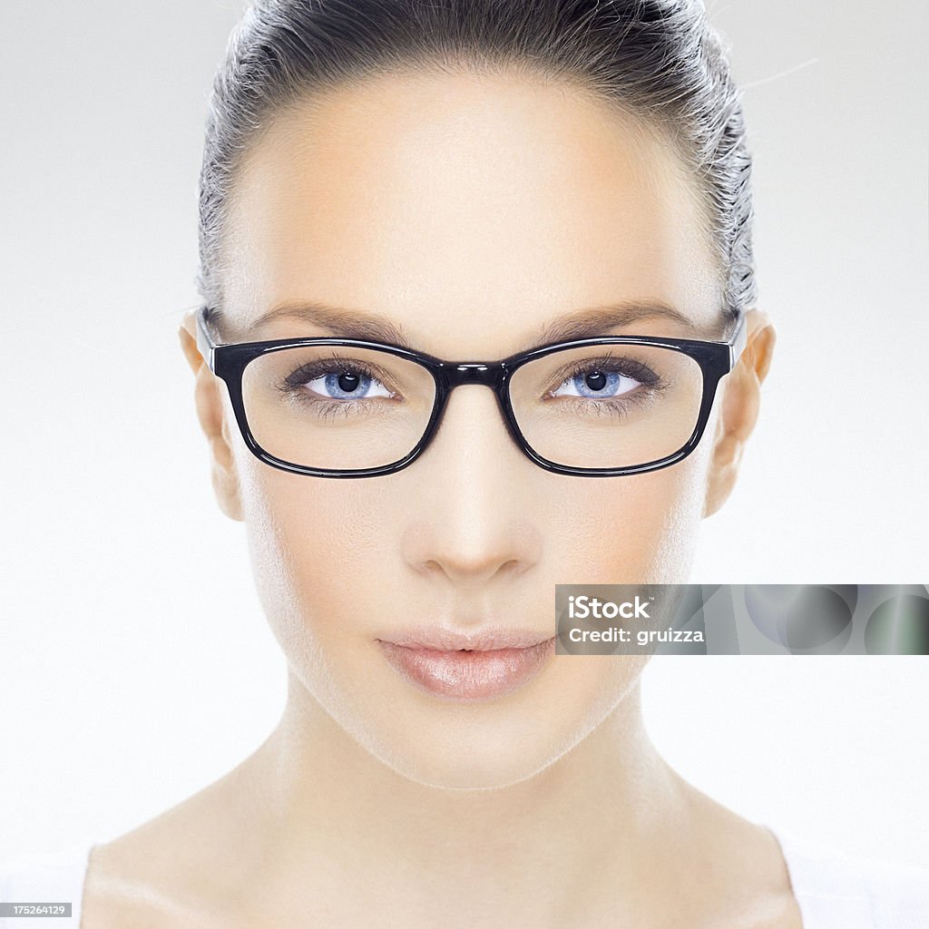 Beauty headshot of a beautiful woman with eyeglasses "R E C O M M E N D A T I O N....Close-up, beauty headshot of a beautiful young woman with eyeglasses. Developed from RAW; retouched with special care and attention; Small amount of grain added for best final impression. Adobe RGB color profile.Same model, same shooting:" 25-29 Years Stock Photo