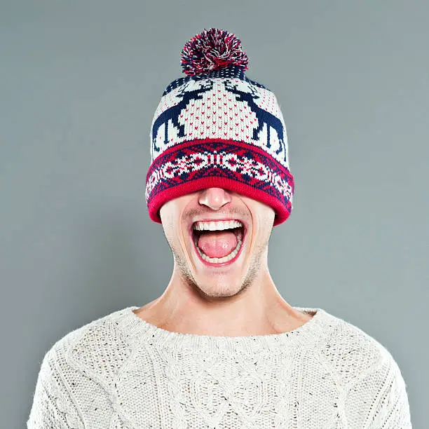 Photo of Happy Young Man in Winter Cap