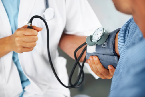 Stethoscope, blood pressure and doctor with mature woman in consultation at hospital or clinic. Healthcare, exam and patient with medical professional for check up for heart health, advice and care.