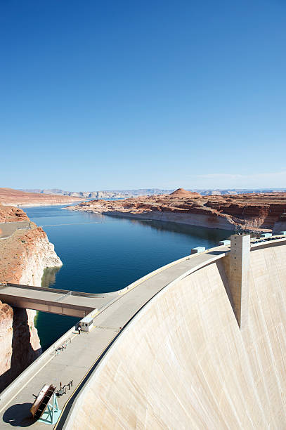 istock Hydroelectric Dam with Reservoir Blue Sky in Desert 175264919