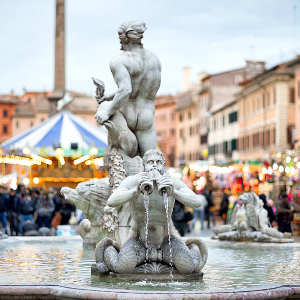 Fontana del Moro at Piazza Navona Christmas time, Rome Italy "Fontana del Moro at Piazza Navona Christmas time, Rome ItalyThe original statues were made by Giacomo della Porta in 1575 and in 1653 the statue of the Moor, by Gian Lorenzo Bernini, was added... these are moved to a museum and the ones in the photo are copies- OTHER photos from Rome, Italy:" fontana del moro stock pictures, royalty-free photos & images