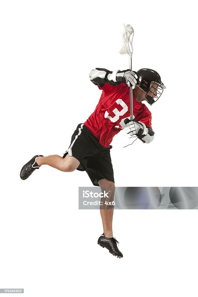 Lacrosse player w akcji - Zbiór zdjęć royalty-free (Lacrosse)