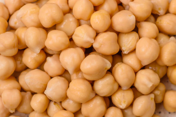 istock Delicious canned chickpeas in a ceramic plate on a dark concrete background 1752653404