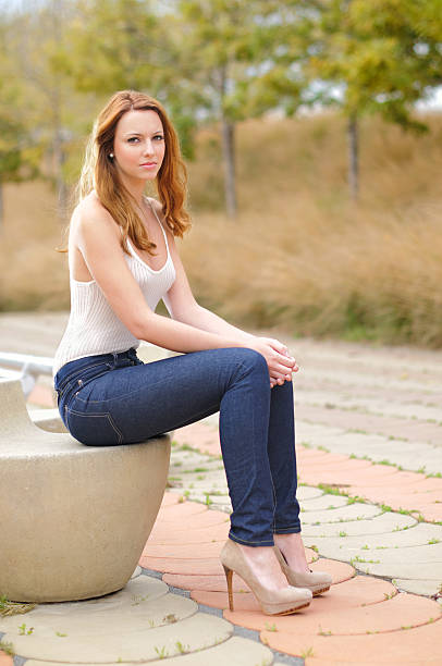 istock Young girl sitting in a park 175265391
