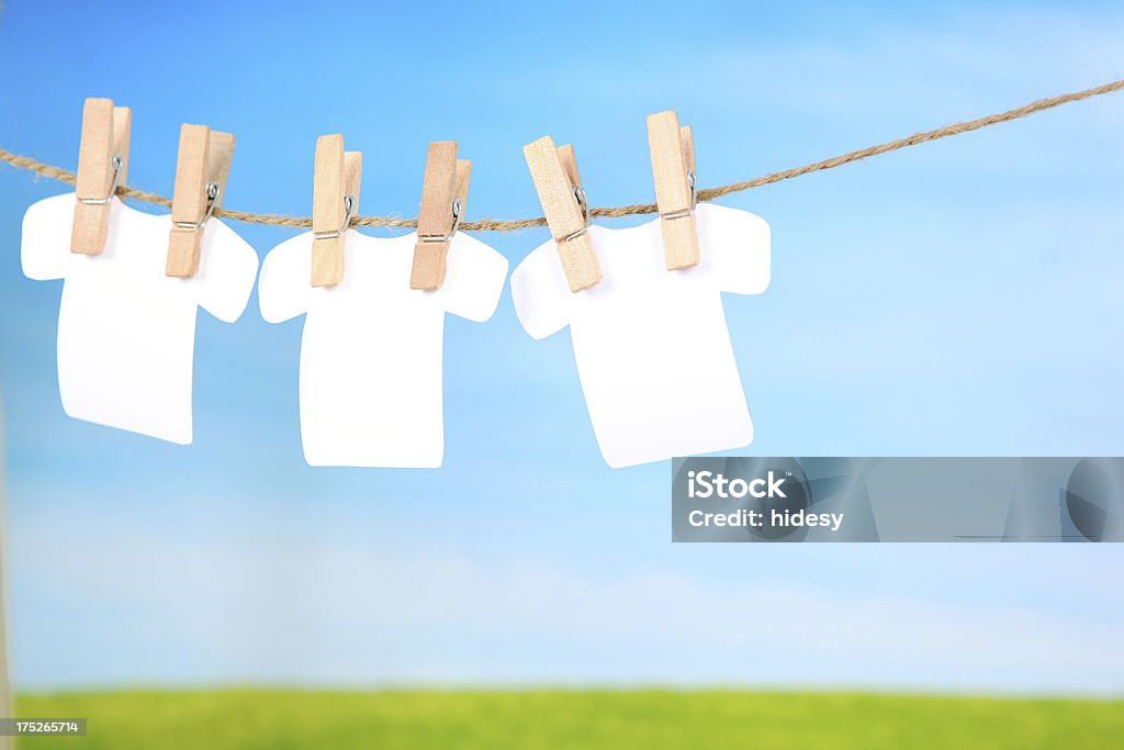 Three Blank Shirts on a clothes line Three cutout blank tshirts made by me on a clothesline Clothespin Stock Photo