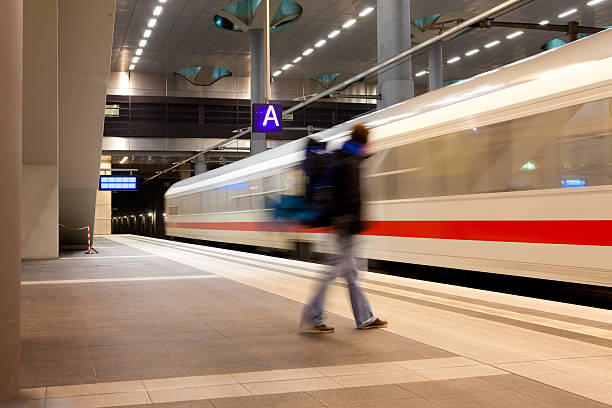 istock Man approaching a departing train at railway station platform 175265768