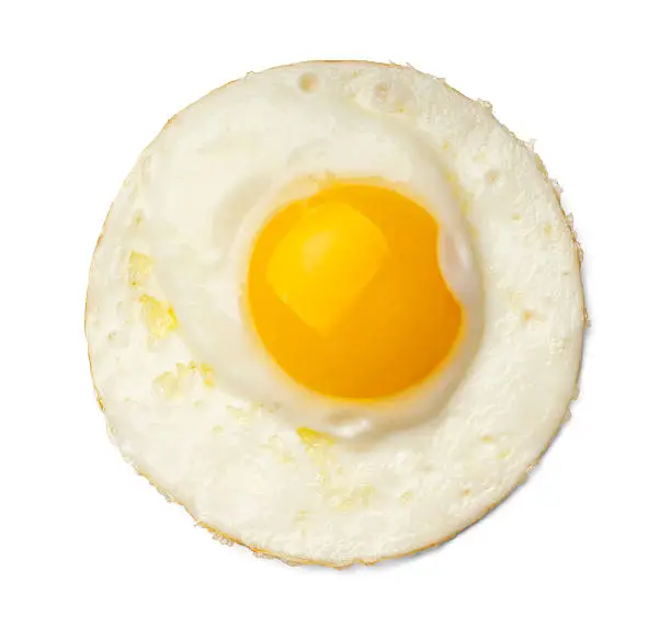 Fried egg on white background.  Please see my portfolio for other food related images.