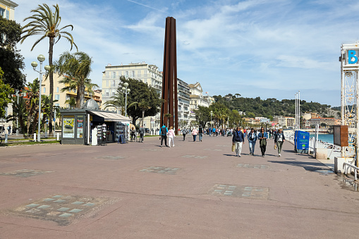 Nice, France - April 21, 2023: A tall steel monument, Neuf Lignes Obliques, by the French artist Bernar Venet, located on the Promenade des Anglais.