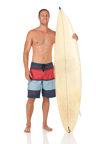 istock Attractive happy man standing with a surfboard 175267917