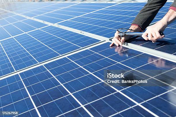 Solar Panel Installing With Torque Wrench Stock Photo - Download Image Now - Solar Panel, Installing, Blue