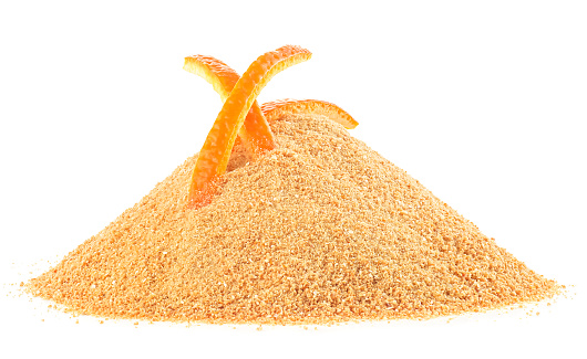 Ground dried orange peel and fresh planed orange skin isolated on a white background