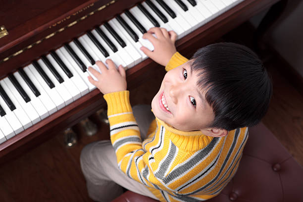 170+ Chinese Boy Playing Piano Stock Photos, Pictures & Royalty-Free