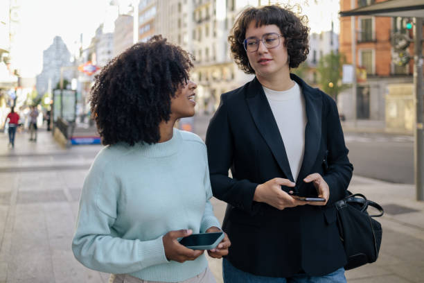 istock Two friends walking around in the street 1752727272