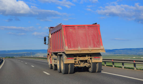 istock Dump truck moving on country road 1752738483