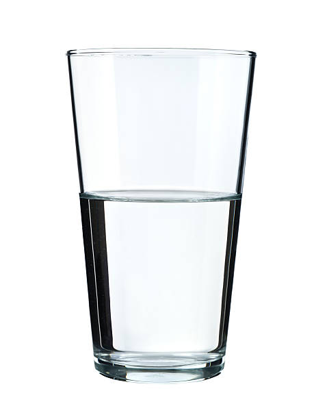 Glass of water isolated on white Tall drinking glass on white half full stock pictures, royalty-free photos & images