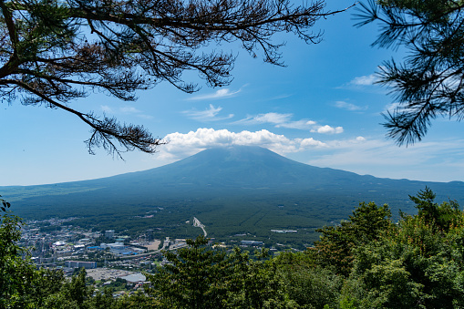 Mount Fuji in Summer clear sky with clouds at the peak