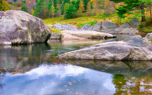 A mountain stream flows among granite outcroppings in central Vermont.