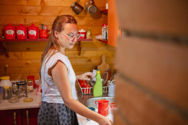 istock Happy woman preparing a simple meal 1752790856