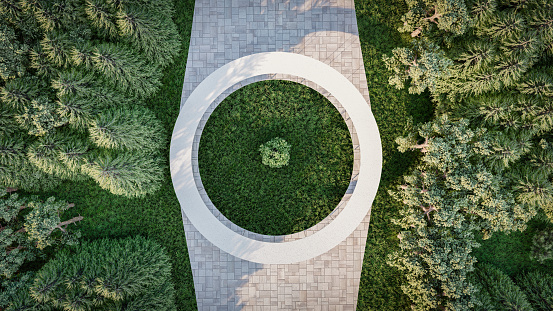 Directly above image of a circular shape built structure in 3d. Multipurpose architecture in nature surrounded by trees.