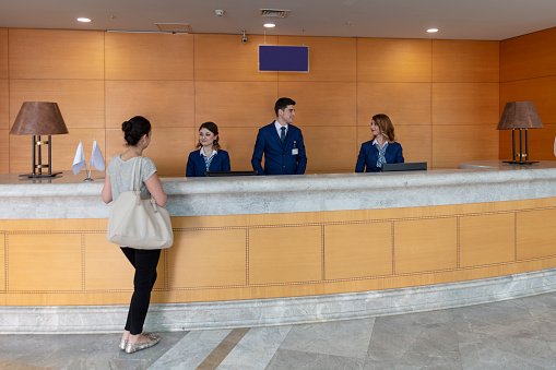 Hospital patient reception desk. Modern and large hospital entrance. A sunny day.