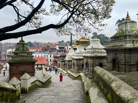 Kathmandu, Nepal: panoramic view of Pashupatinath Temple, famous Hindu temple dedicated to Pashupati, a form of Shiva, along the banks of the sacred Bagmati river, World Heritage Site