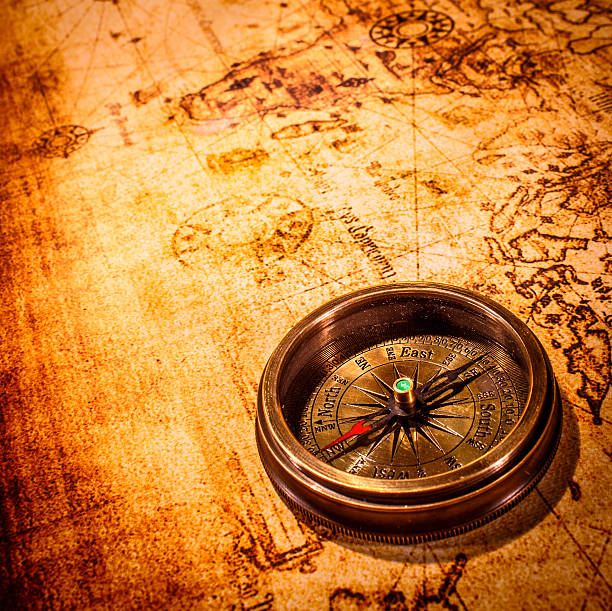 istock Vintage compass lies on an ancient world map. 175287569