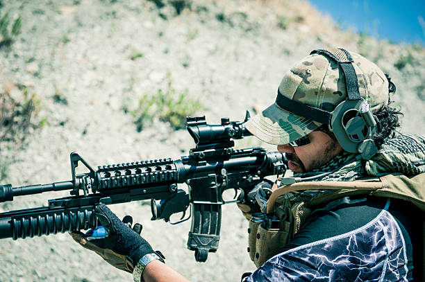 istock Latin Modern Army Soldier Loading Grenade on M203 Launcher 175290011
