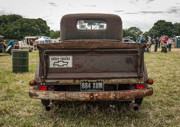 Classic vintage Chevrolet pick up truck rat rod retro project with rusty patina at Dacorum steam country fayre.Rear view of classic car tailgatePotten End, Hertfordshire UK - 26 07 2016: