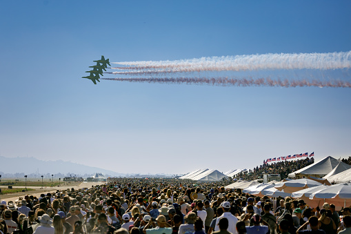 Miramar, California, USA - September 24, 2023: The crowd at America's Airshow 2023 watches the Blue Angels pass the grand stand.