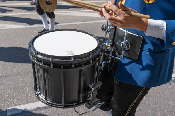 istock A drummer beats a drum marching down the street, close-up photo. 1752946768