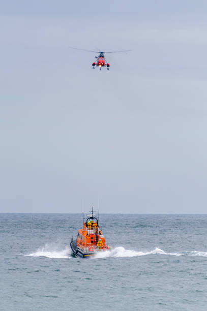 istock Helicopter and RNLB lifeboat during a rescue operation 1752956000