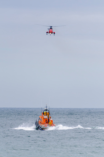 Helicopter and RNLB lifeboat during a rescue operation