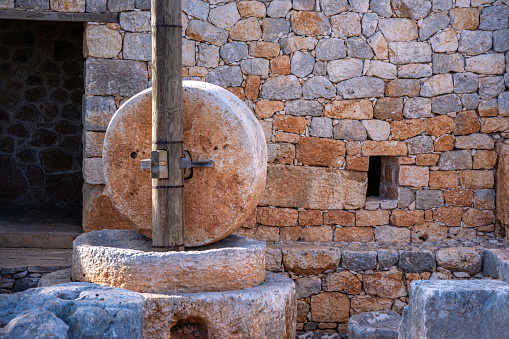 An ancient hand mill made of stones and wood. Stone milling is a traditional part of the bread production process. Anatolia culture.