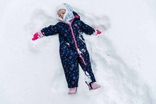 istock Little girl is playing on the snow 1753045289