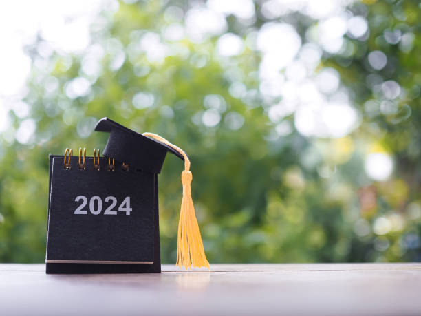 istock Study goals, 2024 Desk calendar with graduation hat. The concept for Resolution, Goal, Action, Planning, and manage time to success graduate. 1753074167