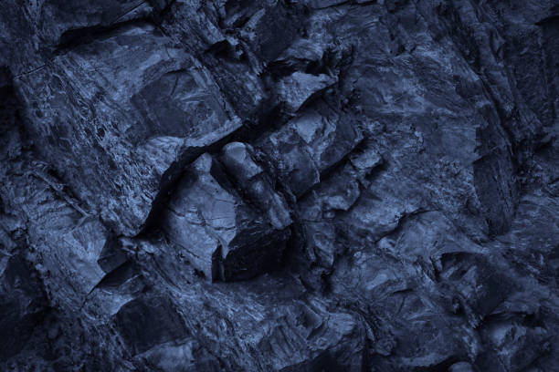 istock Dark blue rock texture. Rough mountain surface. Close-up. Stone background. 3D shape. Cracked. Like cold frost ice. 1753075267