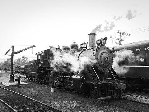 Coal burning K-36 steam locomotive moving toward camera on narrow gauge track.