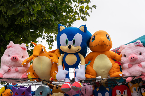Falcon Heights, Minnesota - August 26, 2023: Vendor selling children's toys and  plush stuffed animals for sale at the  Minnesota State Fair, including Pokemon and Sonic the Hedgehog