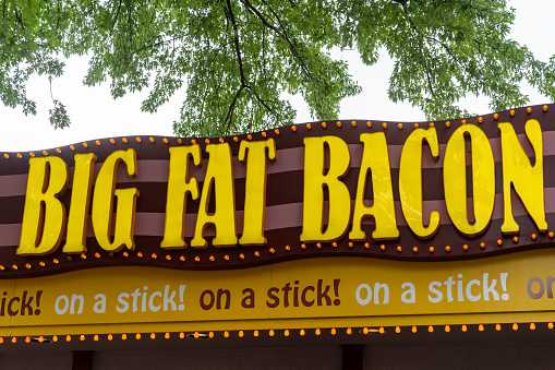 Falcon Heights, Minnesota - August 26, 2023: Booth and sign for Big Fat Bacon on a stick food at the Minnesota State Fair on the fairgrounds