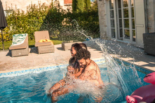 istock Diverse Couple in the Pool at Villa Pool Party 1753195563
