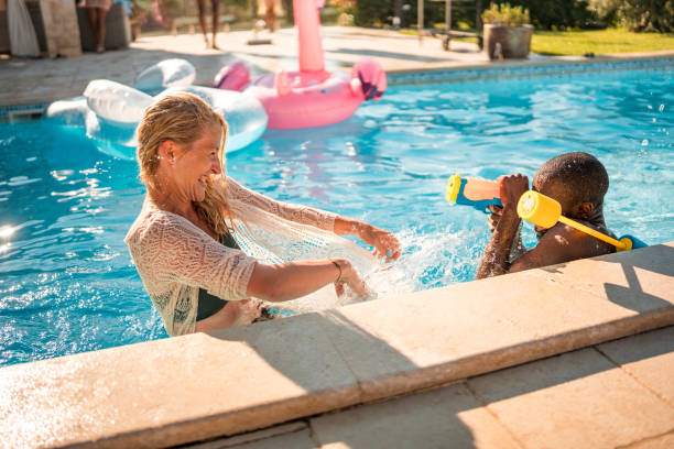 istock Couple's Water Battle by the Pool 1753196095