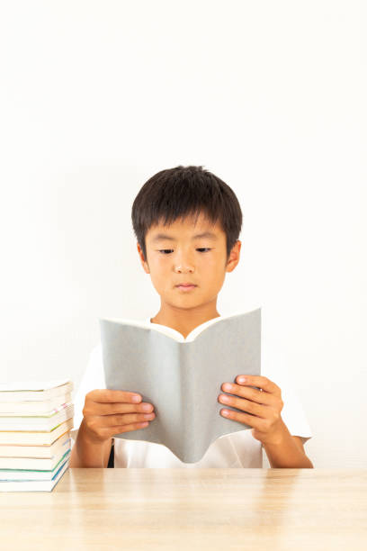 istock A boy reading in his room. 1753203403