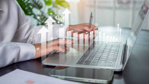 istock Businessman is using computer and showing graph with percentage sign for future business growth plan for business development concept for success and growth. 1753286021
