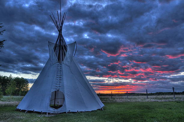 Close-up of an Indian tipi on a field at sunset stock photo