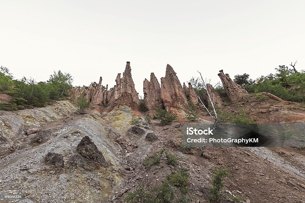 Rock Formation Devil's Town At Sunrise Devil's Town is a peculiar rock formation, located in south Serbia on the Radan Mountain near Kursumlija Andesite Stock Photo