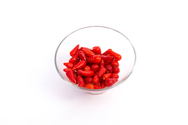 Vermelho Pimenta em um vidro - fotografia de stock