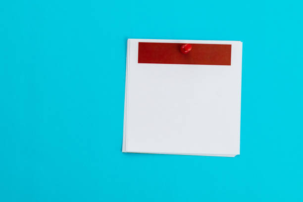 istock Blank calendar with red thumbtack on blue background 1753455115